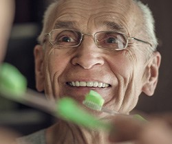 Coppell patient covering mouth from missing teeth